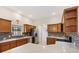 Modern kitchen with stainless steel appliances, granite countertops, and tiled backsplash at 6088 Keckonen Dr, The Villages, FL 32163