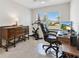 Office with exercise bike, carpet, and window at 6088 Keckonen Dr, The Villages, FL 32163