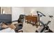 Office with exercise bike, carpet, and desk at 6088 Keckonen Dr, The Villages, FL 32163