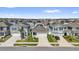 A lovely aerial view of the neighborhood, showcasing the uniformity of the houses at 6856 Perch Hammock Loop, Groveland, FL 34736