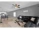 Spacious living area adjacent to the kitchen, featuring a comfortable sectional sofa and modern decor at 6856 Perch Hammock Loop, Groveland, FL 34736