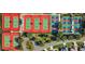 Overhead shot of tennis and pickleball courts surrounded by trees and neighborhood streets at 9025 Se 136Th Loop, Summerfield, FL 34491