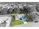 Aerial shot of the house surrounded by mature trees and manicured landscaping at 9025 Se 136Th Loop, Summerfield, FL 34491