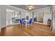 Sunroom with vinyl flooring, neutral wall paint, sliding doors, and an exterior view at 9025 Se 136Th Loop, Summerfield, FL 34491