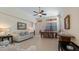 Spacious living room featuring tile flooring, ceiling fan, natural light and open floorplan at 906 Shady Canyon Way, Poinciana, FL 34759