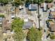 Aerial view of the home showcasing the roof, backyard, and the surrounding neighborhood at 11414 Layton St, Leesburg, FL 34788