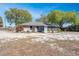 Exterior view of the rear of the home and large open backyard at 11414 Layton St, Leesburg, FL 34788