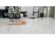 Modern kitchen island featuring quartz countertops and decorative water bottles at 12412 Sw 98Th St, Dunnellon, FL 34432