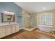 Spa-like bathroom featuring a soaking tub, frameless shower and custom vanity at 12815 Katherine Cir, Clermont, FL 34711