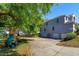 Large home exterior showing a playground, driveway, and two-car garage with lush landscaping at 12815 Katherine Cir, Clermont, FL 34711