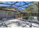 Pool view from house showing screened in enclosure with backyard view at 12815 Katherine Cir, Clermont, FL 34711