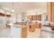 Open kitchen design featuring a breakfast bar, stainless steel appliances, and tile flooring at 13131 Sandy Pine Ln, Clermont, FL 34711