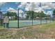 Fenced tennis court offering a place for outdoor recreation at 13131 Sandy Pine Ln, Clermont, FL 34711