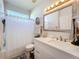 Bright bathroom with a modern vanity and shower/tub combo, offering a fresh and clean aesthetic at 13421 Via Roma Cir, Clermont, FL 34711