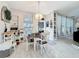 Bright dining area with stylish chandelier and white wood flooring at 13421 Via Roma Cir, Clermont, FL 34711