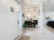 Bright foyer featuring modern tile flooring, an open view to the dining area, and neutral decor at 13421 Via Roma Cir, Clermont, FL 34711