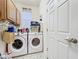 Laundry room featuring a washer and dryer at 13421 Via Roma Cir, Clermont, FL 34711