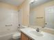 Bathroom featuring a combination tub and shower, and a single sink vanity at 1419 Segovia Pl, The Villages, FL 32162