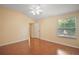 This room features hardwood floors, and a bright window, creating a calm and inviting atmosphere at 1419 Segovia Pl, The Villages, FL 32162