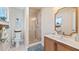 Bright bathroom featuring a glass-enclosed shower, white vanity, and modern fixtures at 16109 Hillside Cir, Montverde, FL 34756