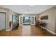 Bright living room featuring wood floors, recessed lighting, and French doors opening to an outdoor patio at 16109 Hillside Cir, Montverde, FL 34756