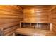 Relaxing at home with a wood paneled sauna with built in benches at 16109 Hillside Cir, Montverde, FL 34756