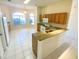 Open kitchen featuring wood cabinets, granite countertops, and stainless steel appliances at 1726 Augustine Dr, Lady Lake, FL 32159