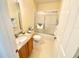 Bathroom with glass enclosed shower and granite countertop at 1726 Augustine Dr, The Villages, FL 32159