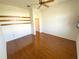 Bedroom with hardwood flooring and a ceiling fan at 1726 Augustine Dr, The Villages, FL 32159