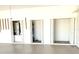 Garage with storage rooms and epoxy floor at 1726 Augustine Dr, The Villages, FL 32159