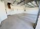 Spacious garage with epoxy flooring and ample storage at 1726 Augustine Dr, The Villages, FL 32159
