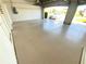 View of the spacious two car garage with epoxy flooring and natural light, leading to the driveway at 1726 Augustine Dr, The Villages, FL 32159