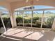 Enclosed lanai with golf course views and beautiful landscaping at 1726 Augustine Dr, The Villages, FL 32159