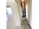 Utility room with water heater and storage space at 1726 Augustine Dr, The Villages, FL 32159