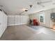 Garage featuring storage cabinets and a small window for natural light at 17660 Se 81St Timberwood Ter, The Villages, FL 32162