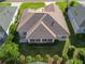 An aerial view shows the home's roof and the screened in porch at 17660 Se 81St Timberwood Ter, The Villages, FL 32162