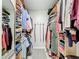 Neatly arranged walk-in closet with ample space for hanging clothes and folded items at 18319 Dells Cove Rd, Groveland, FL 34736