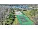 An elevated view of the community's sports courts, pool, and lakeside amenities, enhancing the lifestyle at 1851 Soaring Heights Cir, Orlando, FL 32837