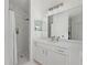 Modern bathroom boasts a spacious shower with white marble and a clear glass door, along with a vanity and sink at 1851 Soaring Heights Cir, Orlando, FL 32837