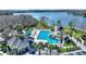 An aerial view of the community pool area, complete with a water slide and ample lounging space at 1851 Soaring Heights Cir, Orlando, FL 32837