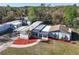 Aerial view of property showcasing landscaping and multiple structures at 19050 Nfs-573, Altoona, FL 32702