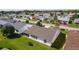 Home aerial view showcasing neighborhood, the house, big roof, and community at 2008 Cipriano Pl, The Villages, FL 32159