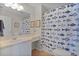 Bathroom featuring a charming fish-themed shower curtain, tile floors and spacious counter area at 2008 Cipriano Pl, The Villages, FL 32159