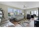 Bright living room with ample natural light, comfortable seating, and modern decor at 2008 Cipriano Pl, The Villages, FL 32159