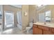 Bathroom complete with a soaking tub, walk-in shower, and single vanity at 21046 County Road 33, Groveland, FL 34736