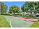 Outdoor basketball court featuring well-maintained green and red surfaces, ideal for recreational activities at 2205 Stonebridge Way, Clermont, FL 34711