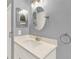 Modern bathroom with updated vanity, sink, and mirror at 2205 Stonebridge Way, Clermont, FL 34711