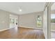 Bedroom features plank flooring, ceiling fan, and glass sliding doors at 2205 Stonebridge Way, Clermont, FL 34711