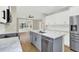 This kitchen features an island with modern stainless steel appliances and marble countertops at 2205 Stonebridge Way, Clermont, FL 34711