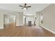 Open-concept kitchen featuring hardwood floors and a view of the living room at 2205 Stonebridge Way, Clermont, FL 34711